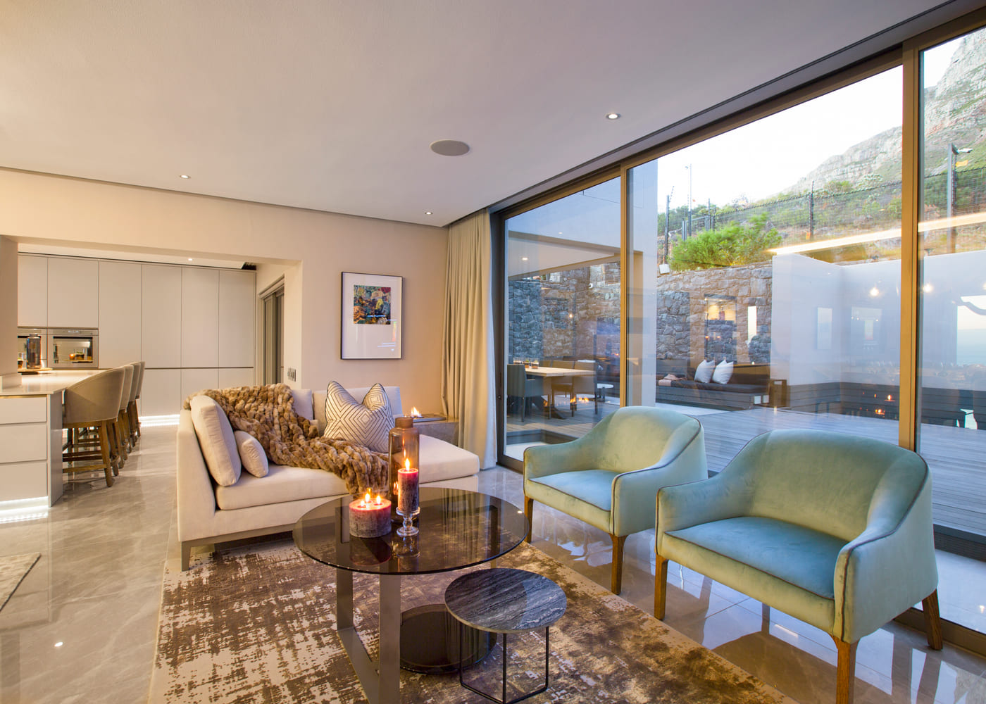 Coastal living room opening onto a sea view terrace