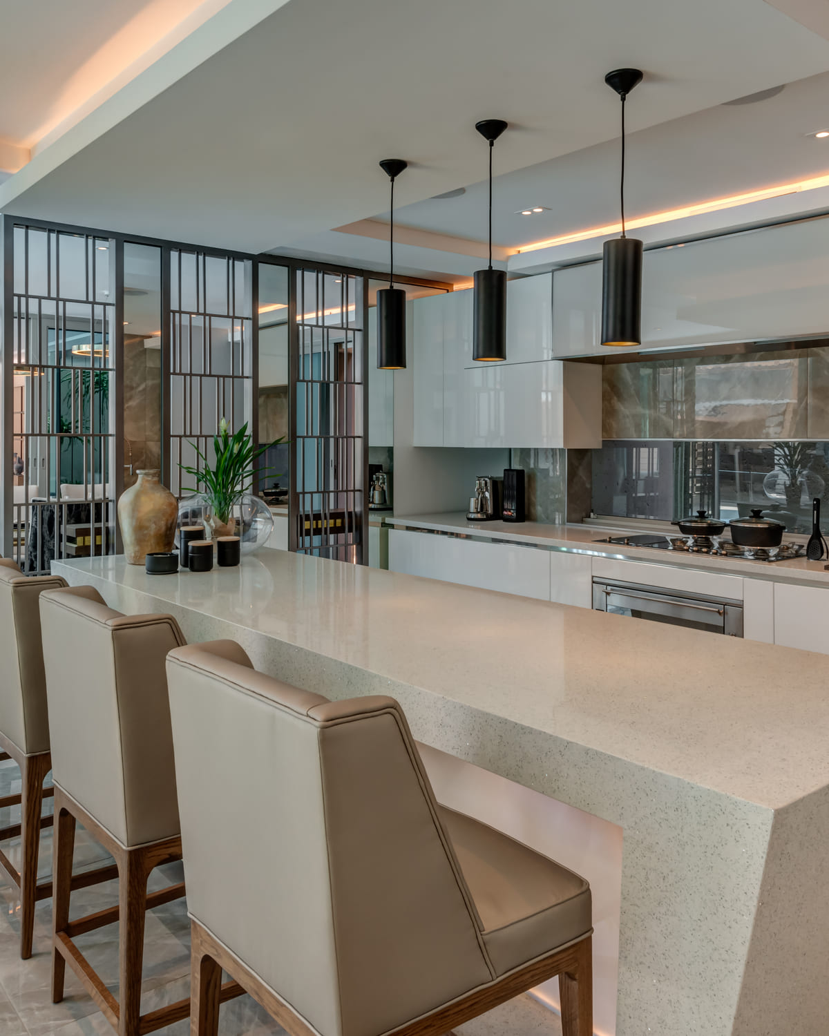 Bespoke kitchen with layered lighting and stone surfaces