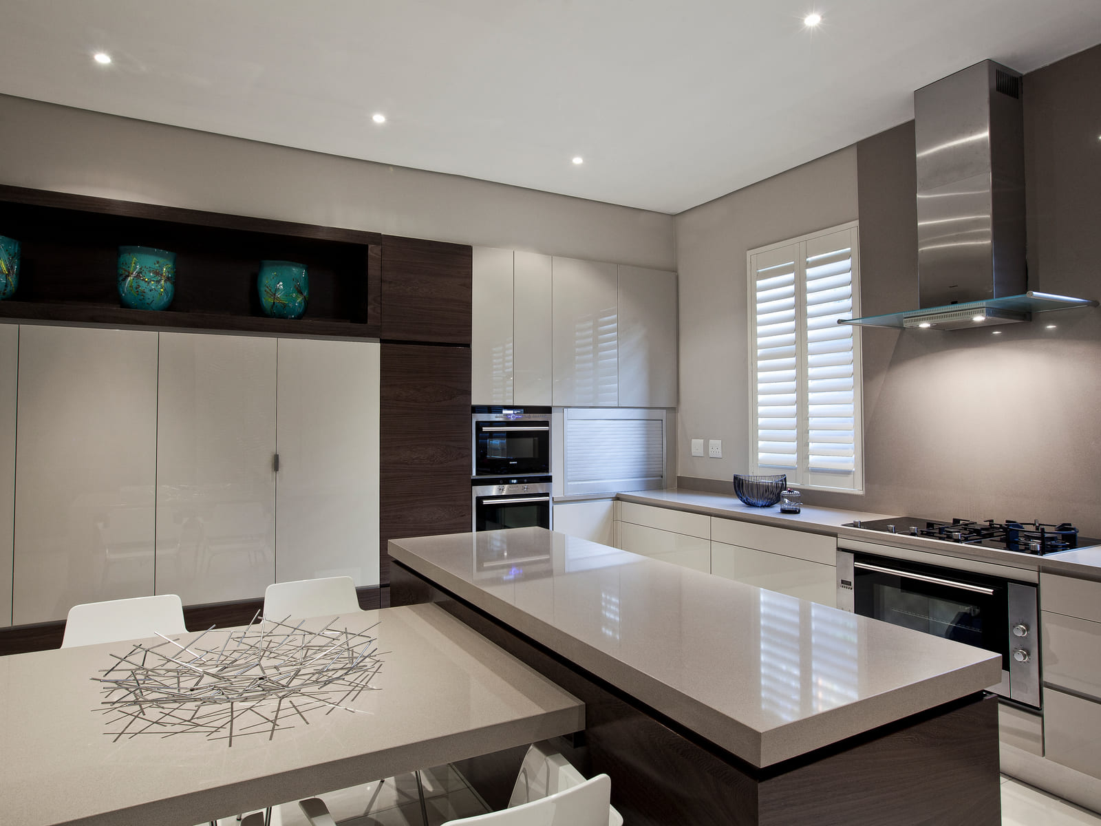 Bespoke kitchen with stone island, integrated appliances and handleless cabinetry