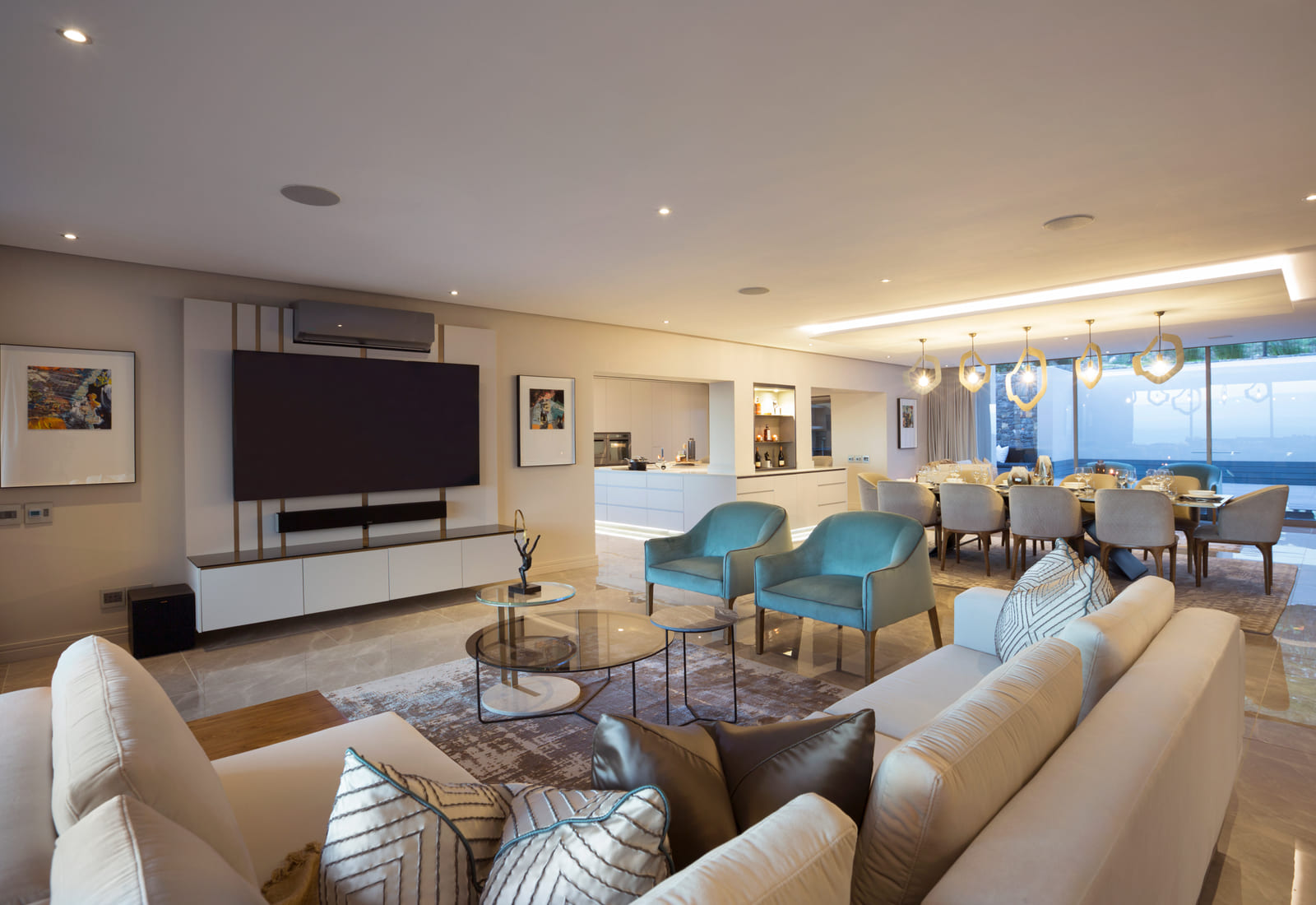 Open plan living and dining area opening to a mountain view