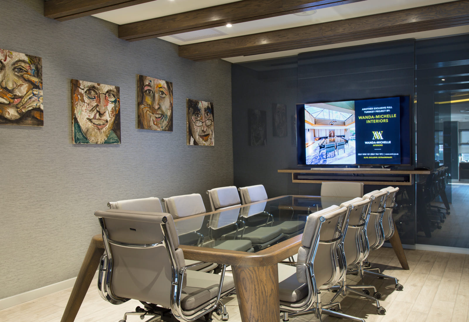 Boardroom with a timber ceiling, glass partitioning and art