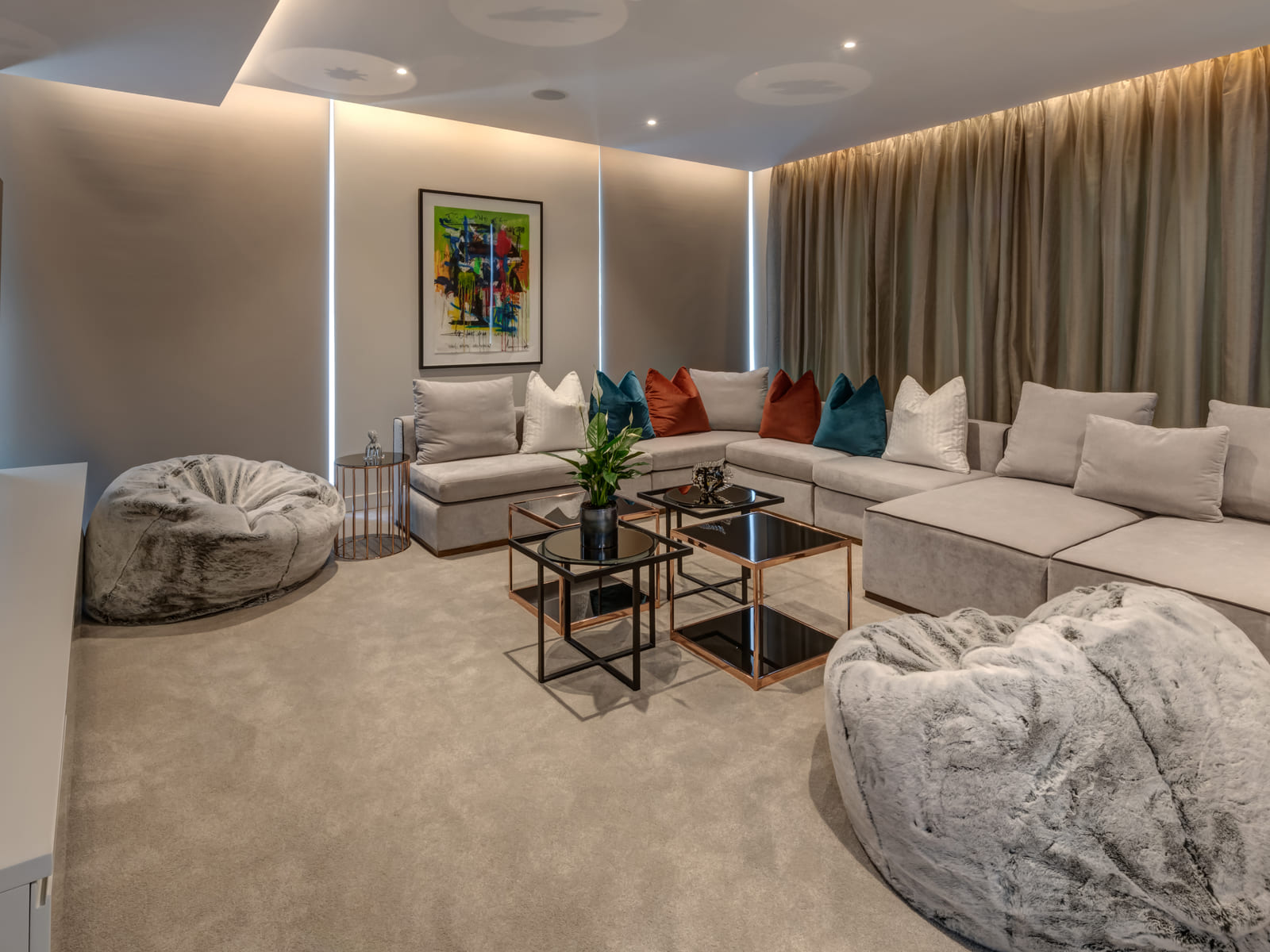 Modern contemporary living room with layered neutral finishes and bespoke joinery